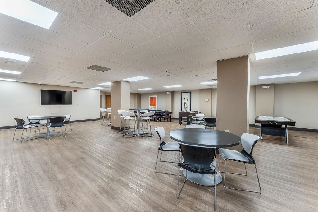 2110 Harmon Cove Tower Secaucus, NJ 07094 - Photo 47 of 50 a living room with furniture and a wooden floor