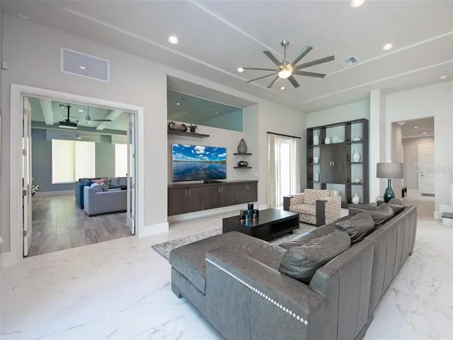 a living room with furniture and a large window