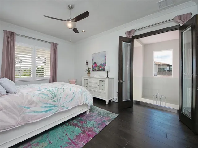 a bathroom with a granite countertop sink mirror vanity and toilet