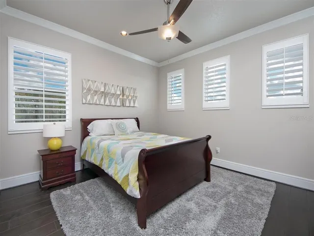 a bathroom with a double vanity sink toilet and shower