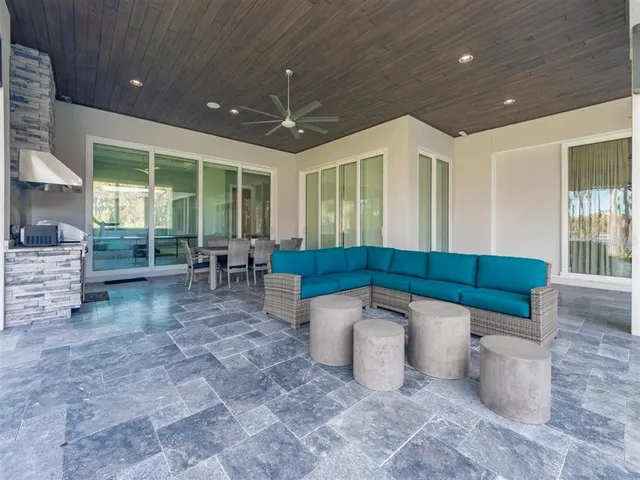 a dining area with a table and chairs