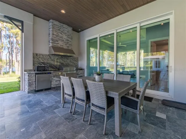 a sitting area with furniture and wooden floor