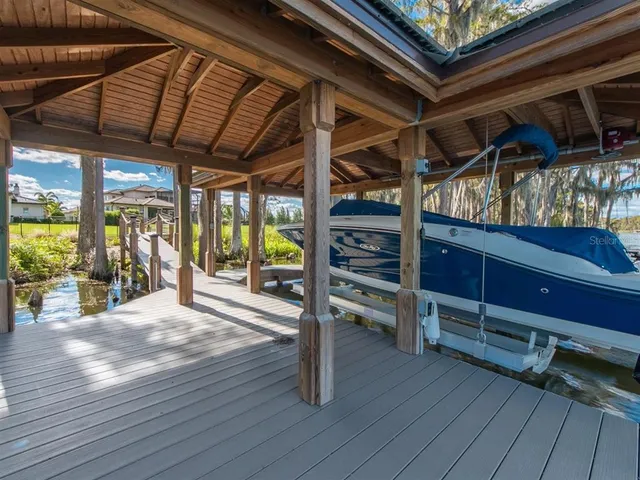 a view of a lake with houses in the back