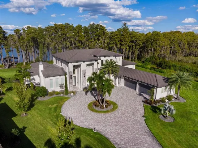an aerial view of a house with garden space and street view
