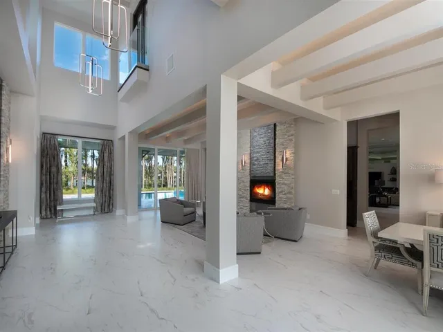 a view of an entryway and livingroom with furniture