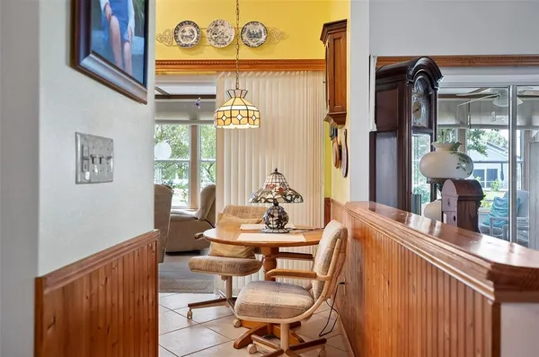 a view of a dining room with furniture and window