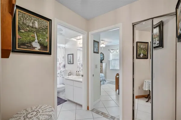 a bathroom with a shower and a mirror