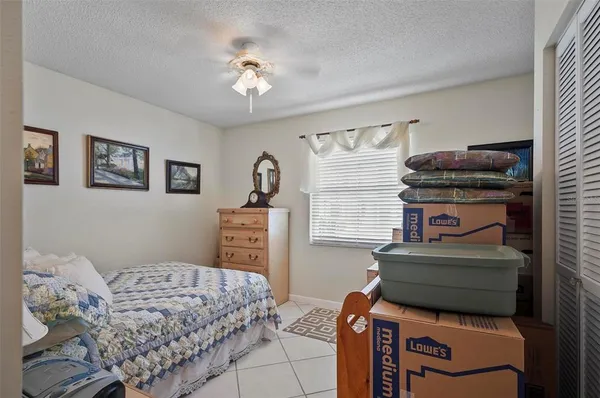 a bedroom with furniture and a chandelier