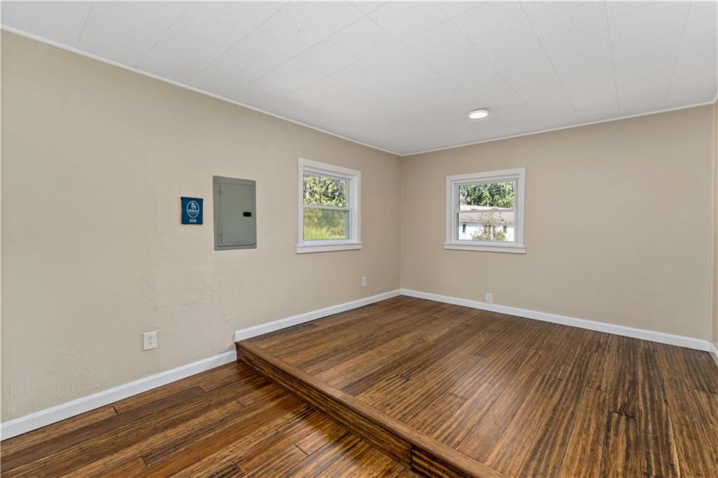 130 Patton Lane Clinton, PA 15026 - Photo 13 of 36 a view of an empty room with a window and wooden floor