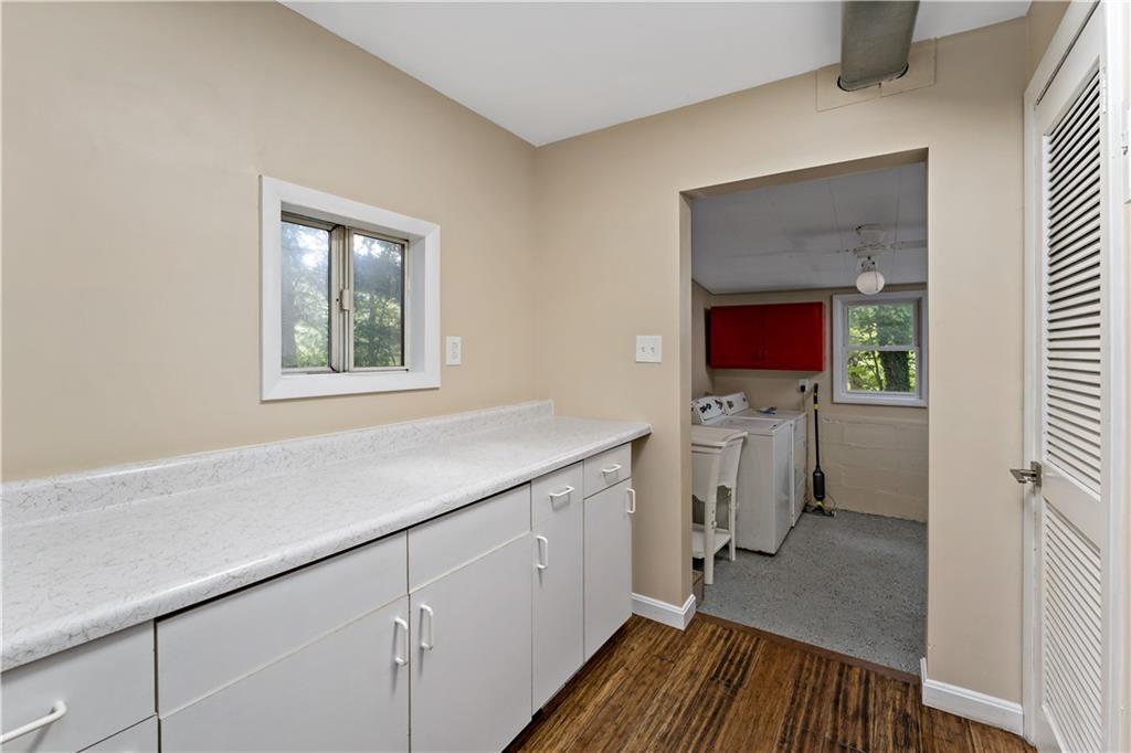 130 Patton Lane Clinton, PA 15026 - Photo 19 of 36 a kitchen with a sink window and cabinets