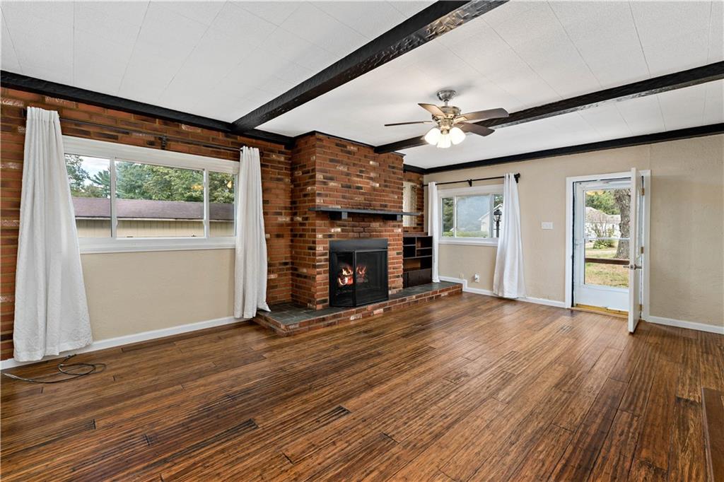 130 Patton Lane Clinton, PA 15026 - Photo 4 of 36 a view of an empty room with a fireplace and a window