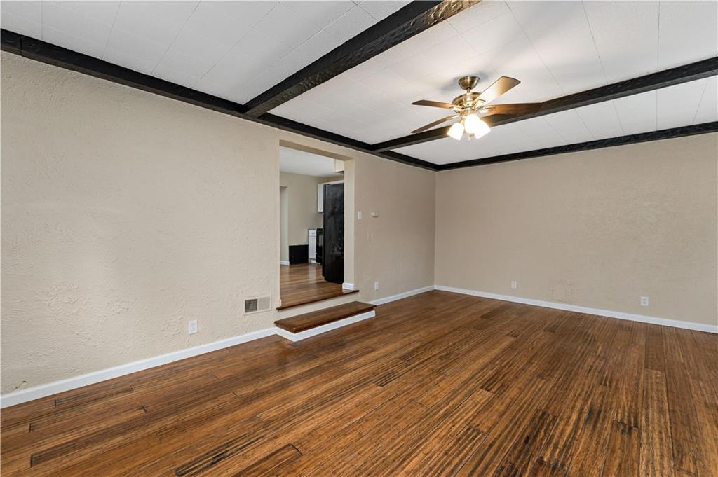 130 Patton Lane Clinton, PA 15026 - Photo 5 of 36 a view of an empty room with wooden floor and a ceiling fan