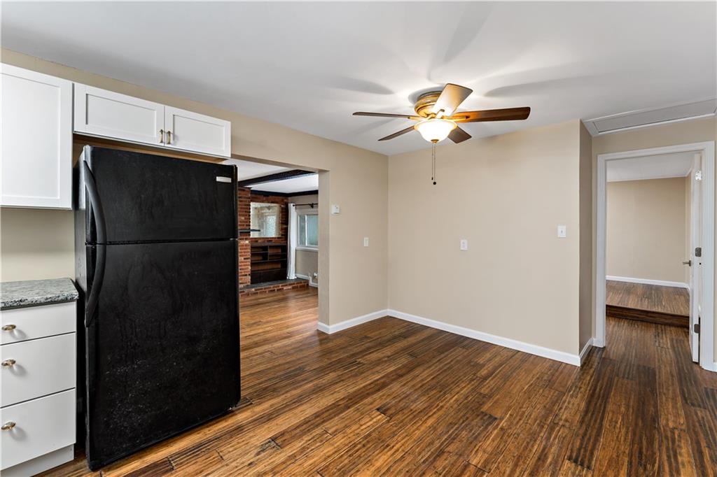 130 Patton Lane Clinton, PA 15026 - Photo 6 of 36 a view of a refrigerator in kitchen and wooden floor