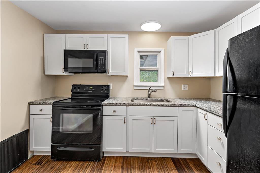 130 Patton Lane Clinton, PA 15026 - Photo 10 of 36 a kitchen with white cabinets stainless steel appliances and sink