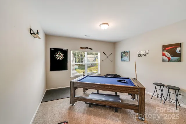 a bedroom with furniture and window
