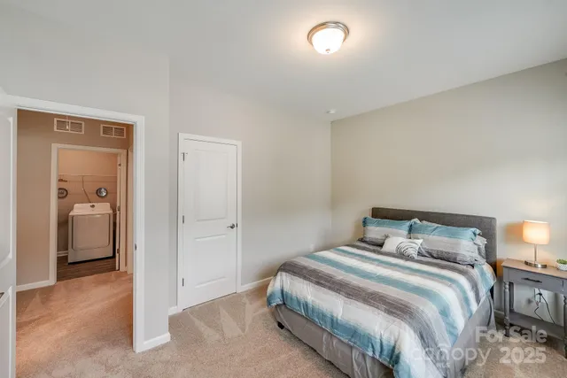 a bedroom with a bed and a view of bedroom