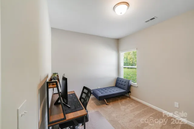 a room with furniture and a window