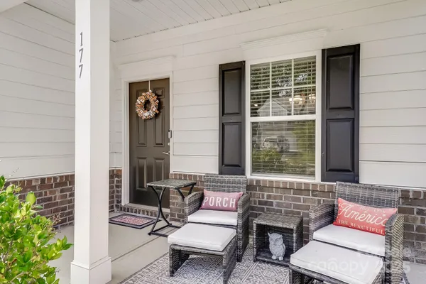 a outdoor living space with furniture and a potted plant
