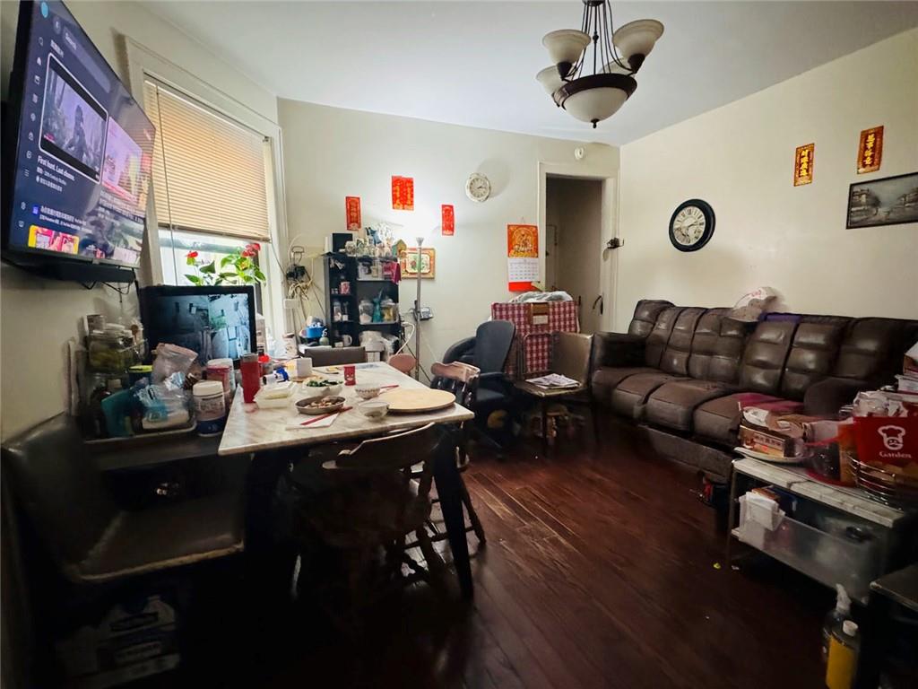328 91st Street Brooklyn, NY 11209 - Photo 11 of 27 a living room with furniture a rug and a window
