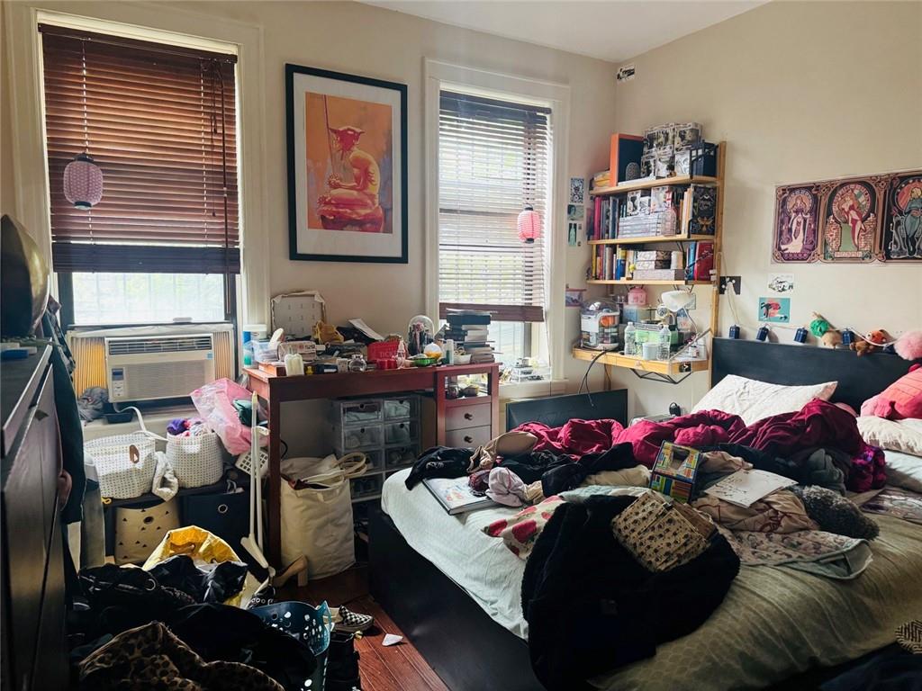 328 91st Street Brooklyn, NY 11209 - Photo 13 of 27 a bedroom with furniture and a bed