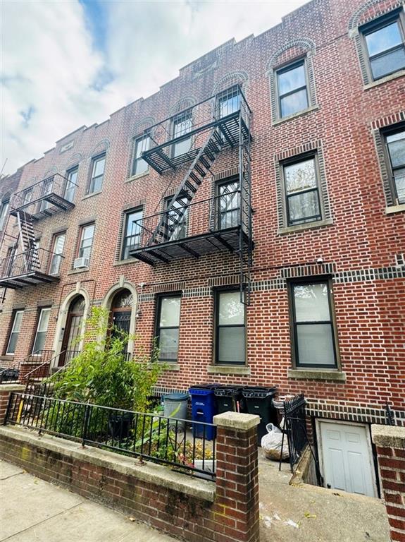 328 91st Street Brooklyn, NY 11209 - Photo 2 of 27 a front view of a house with garden