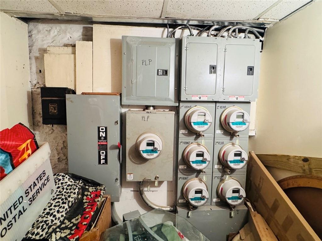 328 91st Street Brooklyn, NY 11209 - Photo 25 of 27 a bathroom with a refrigerator a sink and a window