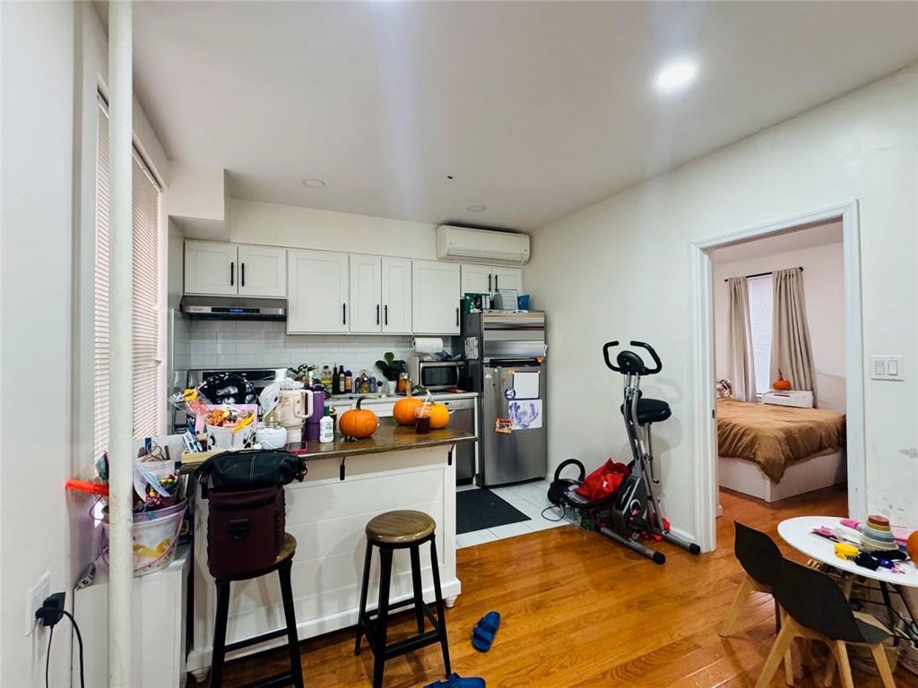 328 91st Street Brooklyn, NY 11209 - Photo 5 of 27 a view of a kitchen and dining room