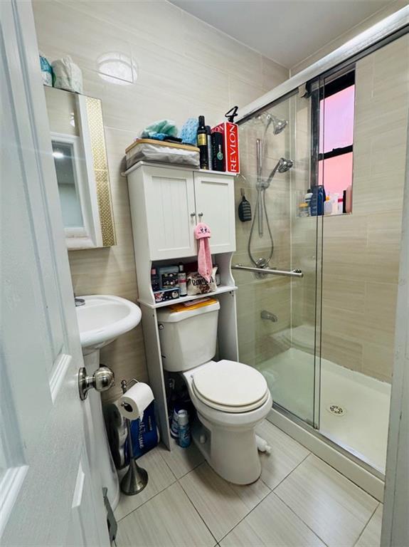 328 91st Street Brooklyn, NY 11209 - Photo 8 of 27 a bathroom with a toilet and a shower