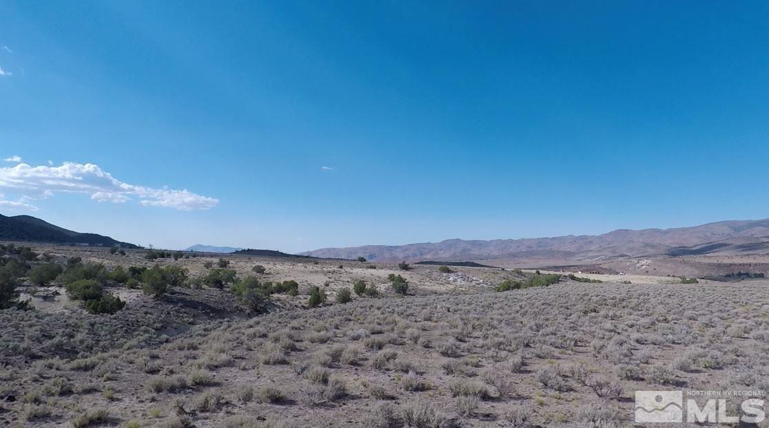 0 Serenity Place Reno, NV 89510 - Photo 6 of 16 a view of a dry field with mountains in the background