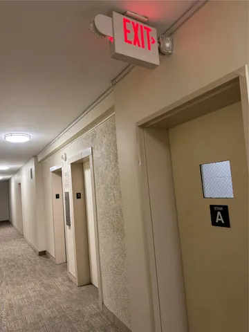 a view of a hallway and closet