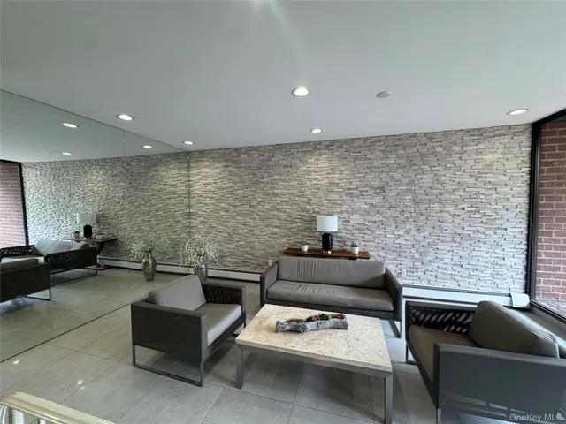 a living room with furniture and white walls