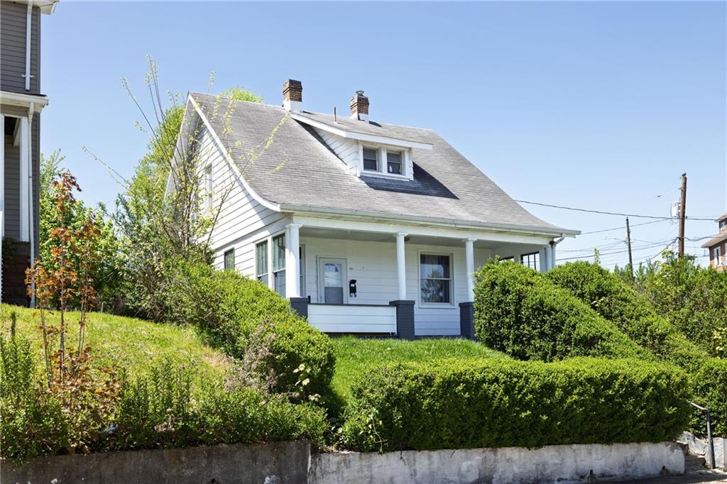 649 South 14th Street Monessen, PA 15062 - Photo 3 of 4 a front view of a house with garden