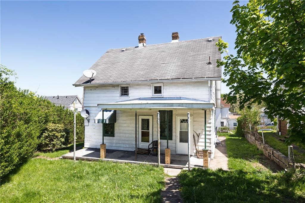 649 South 14th Street Monessen, PA 15062 - Photo 4 of 4 front view of a house with a yard