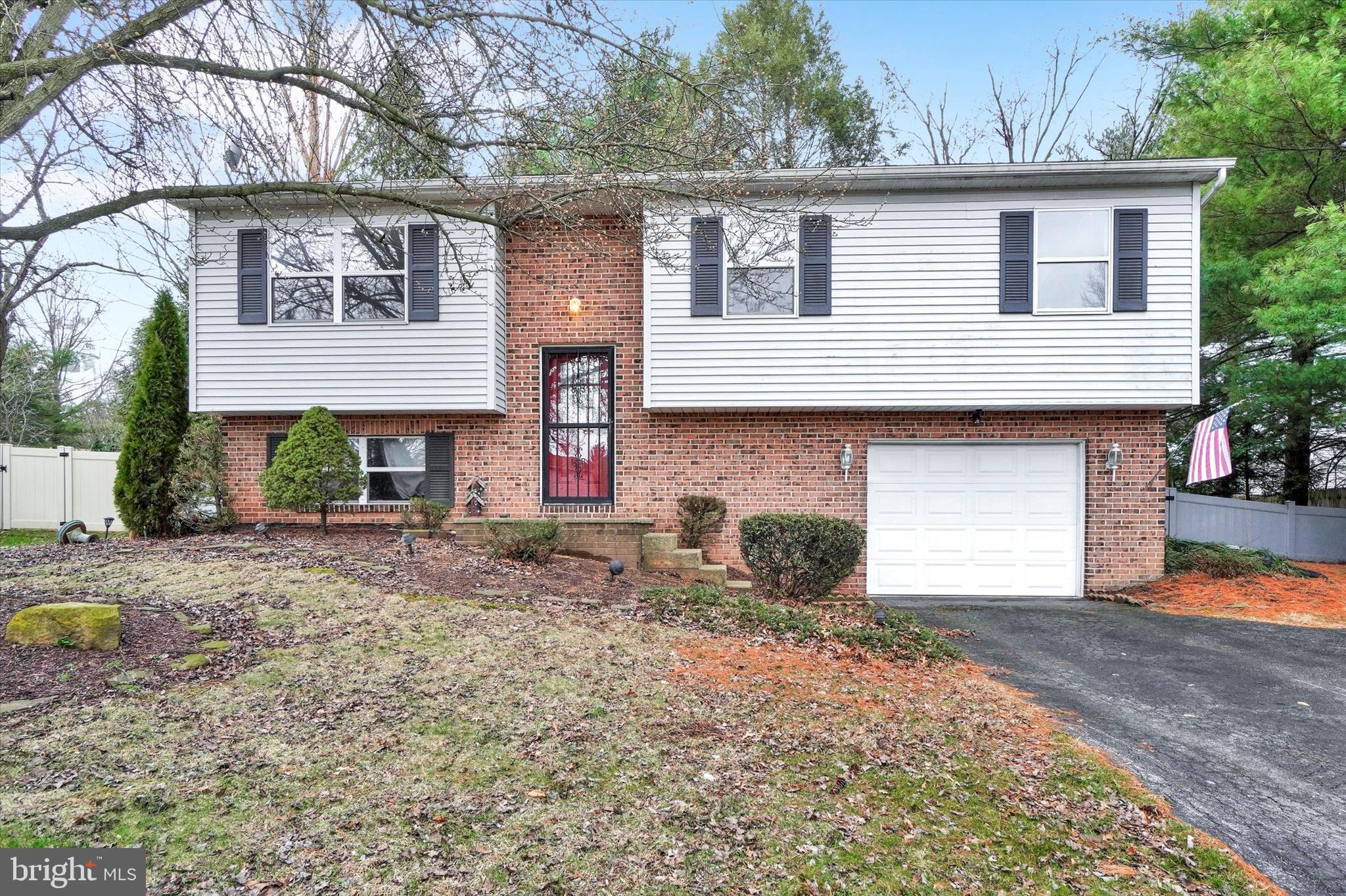 a front view of a house with garage
