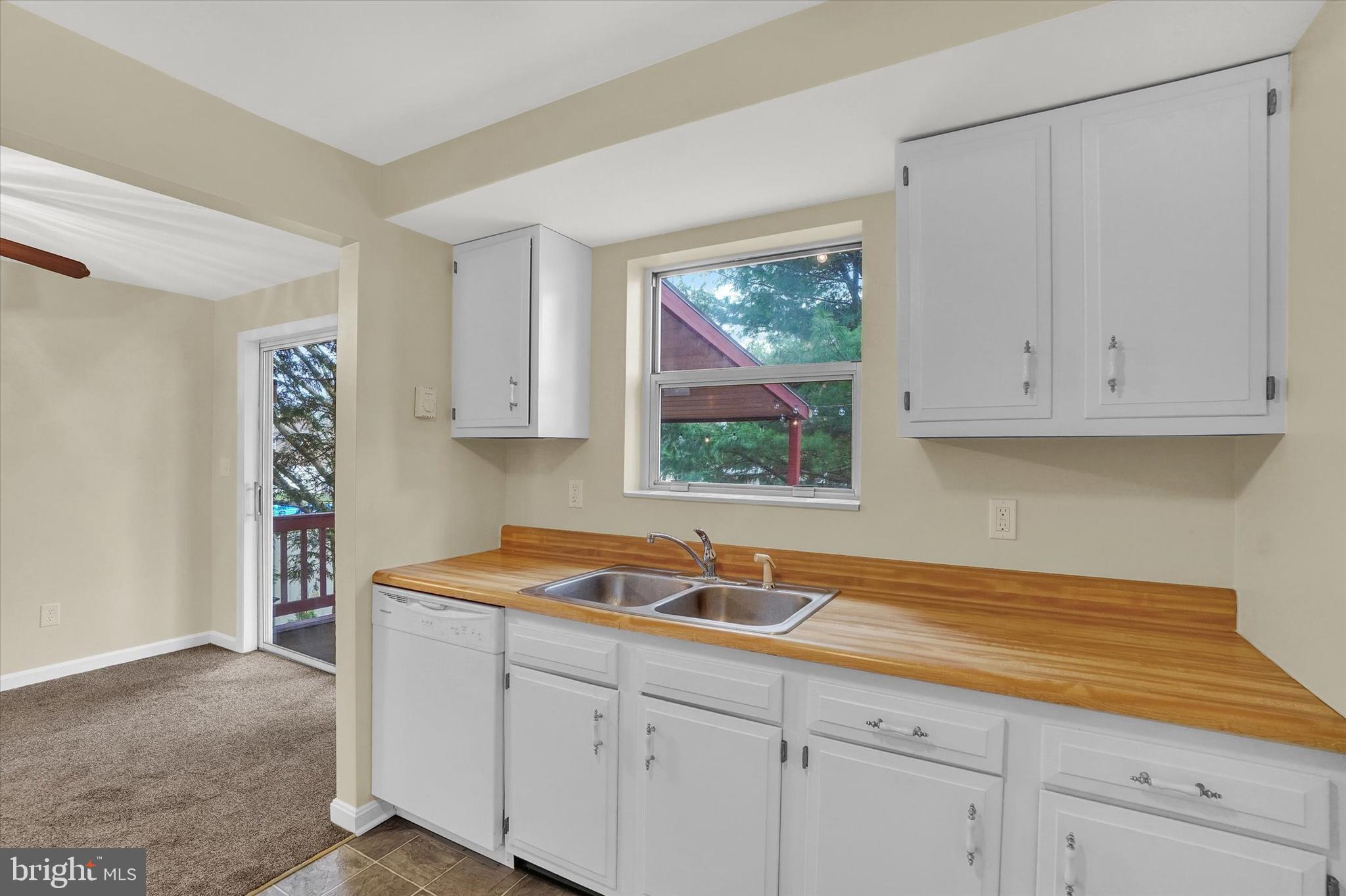 3530 Middleboro Road Dover, PA 17315 - Photo 11 of 32 a kitchen with stainless steel appliances granite countertop white cabinets sink and window