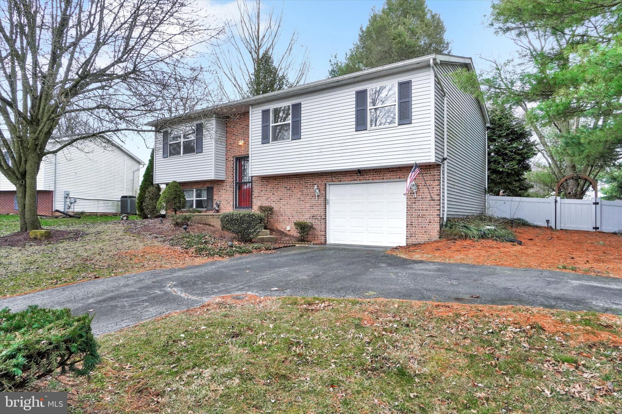 3530 Middleboro Road Dover, PA 17315 - Photo 3 of 32 a front view of a house with a yard and garage