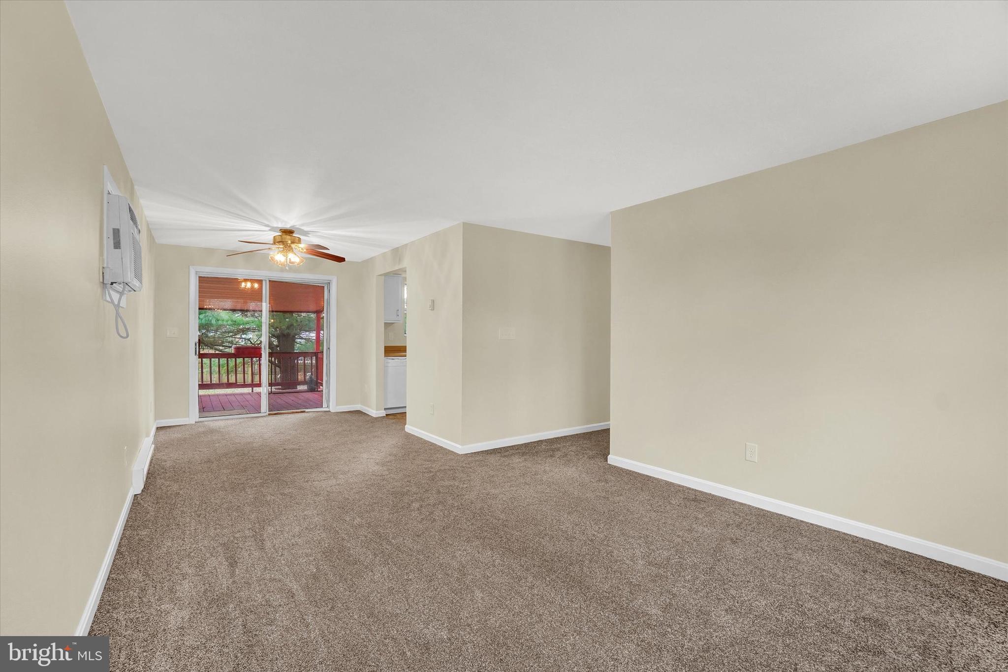 3530 Middleboro Road Dover, PA 17315 - Photo 6 of 32 a view of a big room with windows and chandelier fan