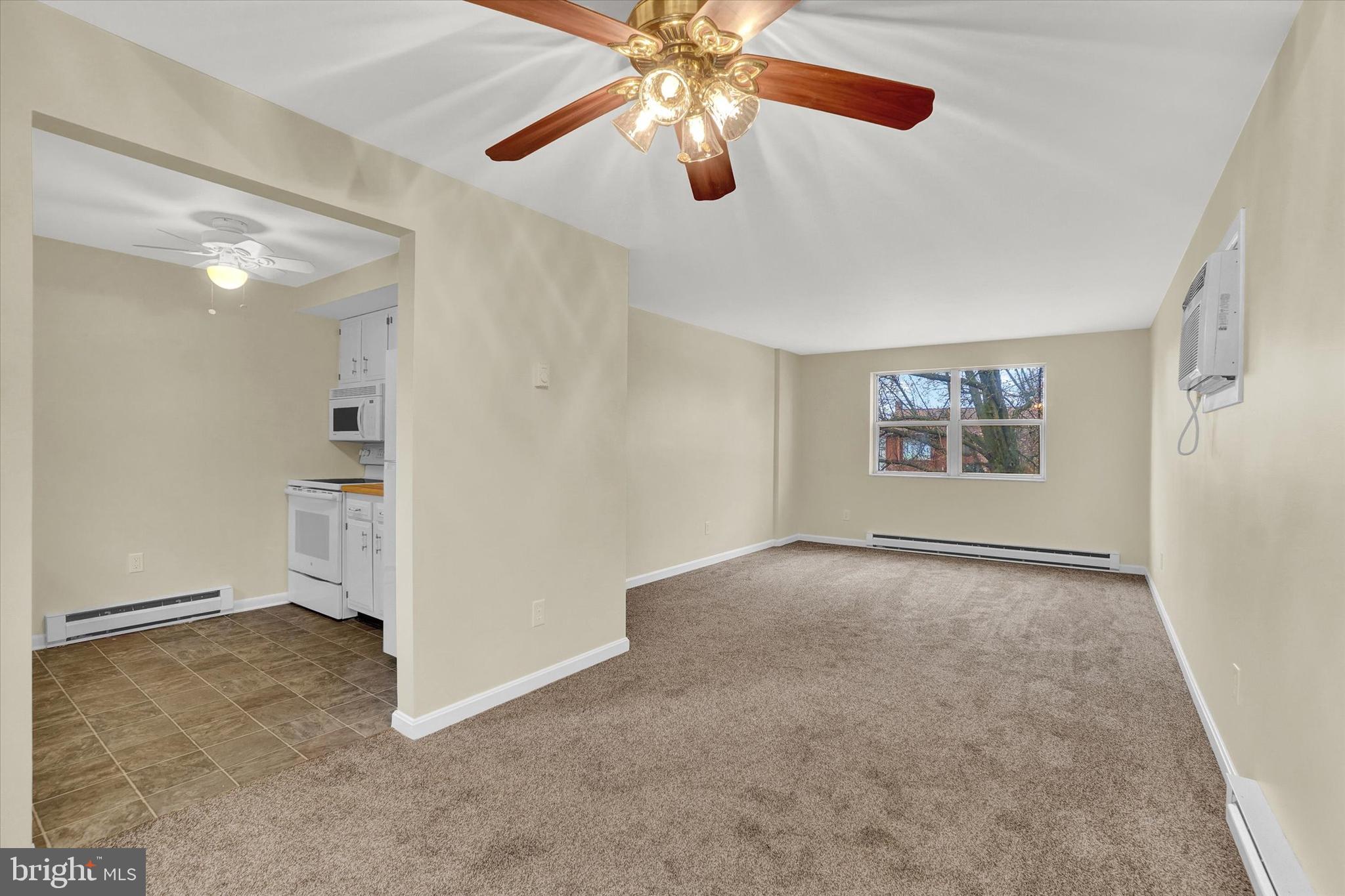3530 Middleboro Road Dover, PA 17315 - Photo 8 of 32 an empty room with chandelier fan and windows