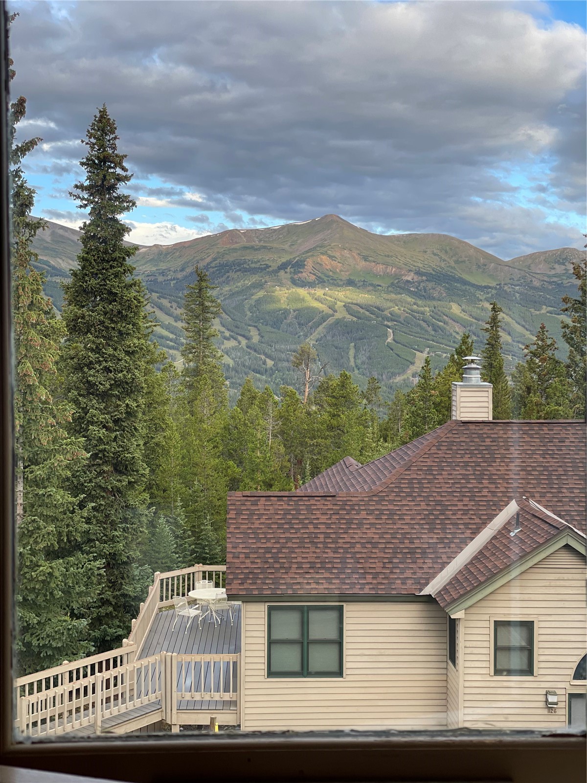 1120 Baldy Road, Unit 1120 Breckenridge, CO 80424 - Photo 2 of 38 Your views of the Breckenridge Ski Resort from the living room as you relax in front of the wood fireplace.