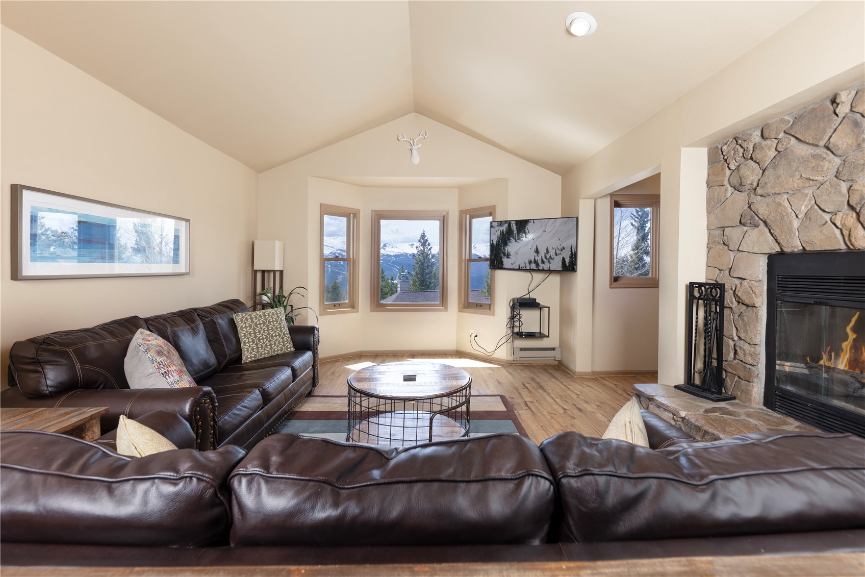 1120 Baldy Road, Unit 1120 Breckenridge, CO 80424 - Photo 3 of 38 Enjoy breathtaking mountain views from your Great Room while you relax around the wood fireplace.