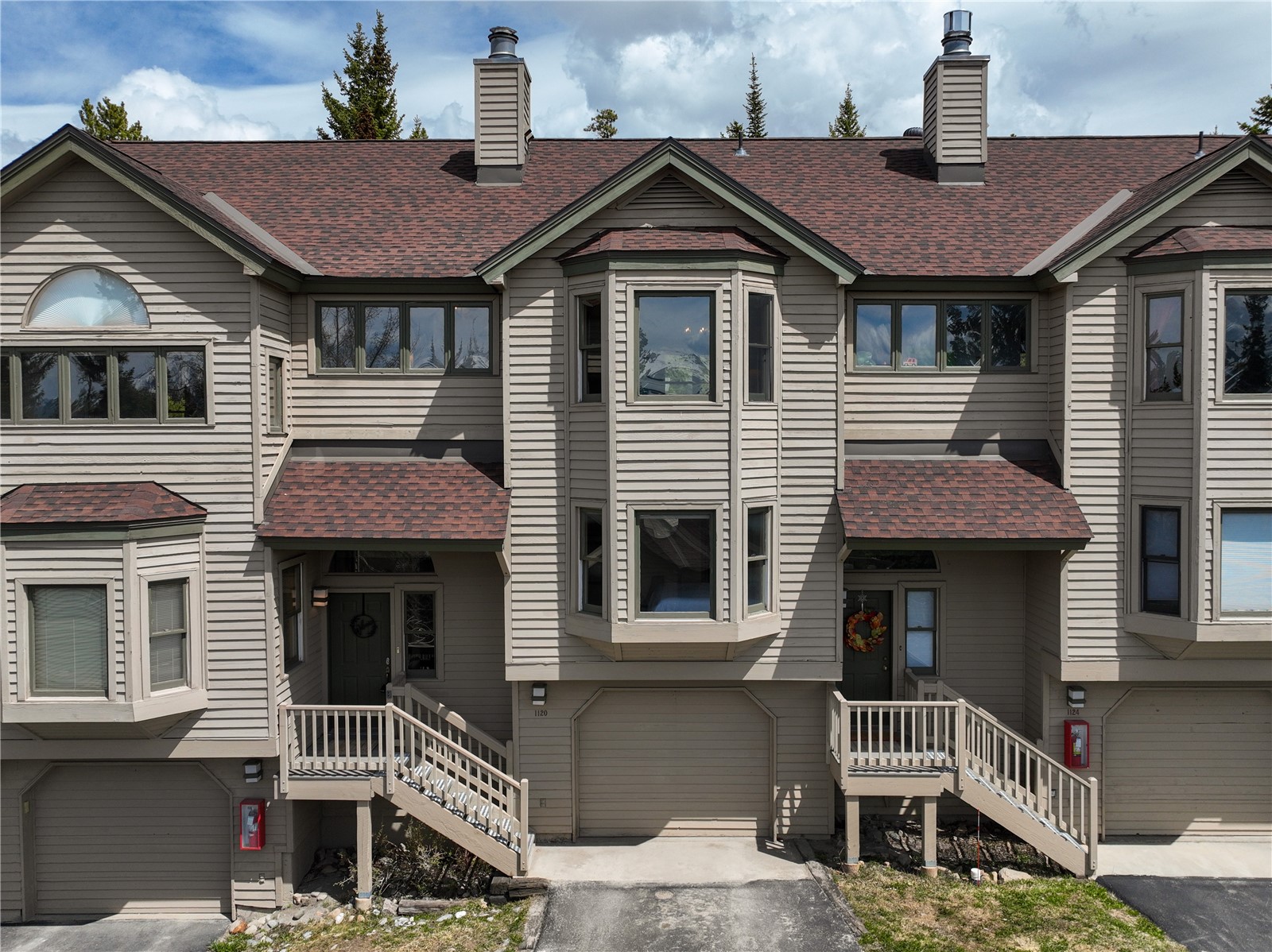1120 Baldy Road, Unit 1120 Breckenridge, CO 80424 - Photo 33 of 38 Residence 1120 at High Timber Townhomes includes a garage and surface parking in front of the garage.