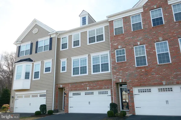 a front view of a building with many windows