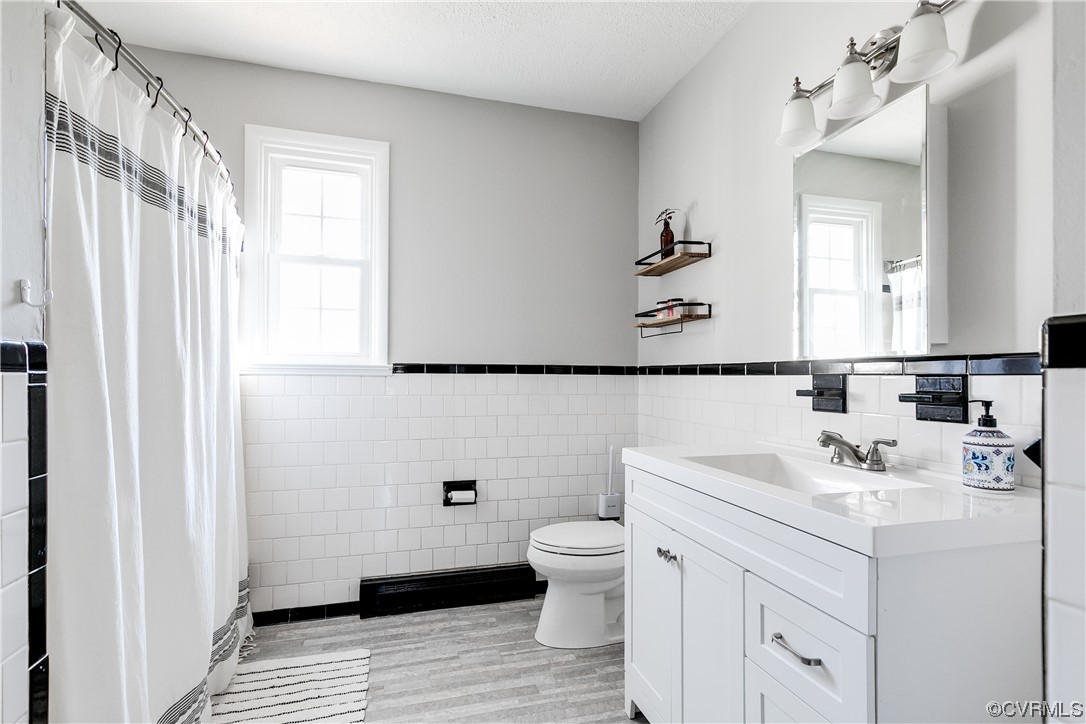 13409 Oak Lane Midlothian, VA 23113 - Photo 15 of 19 a bathroom with a sink a toilet and shower curtain