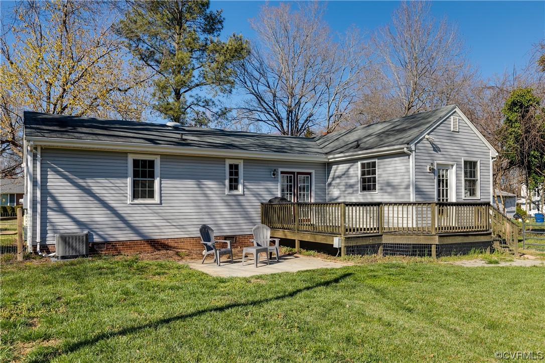13409 Oak Lane Midlothian, VA 23113 - Photo 17 of 19 a front view of a house with a yard table and chairs