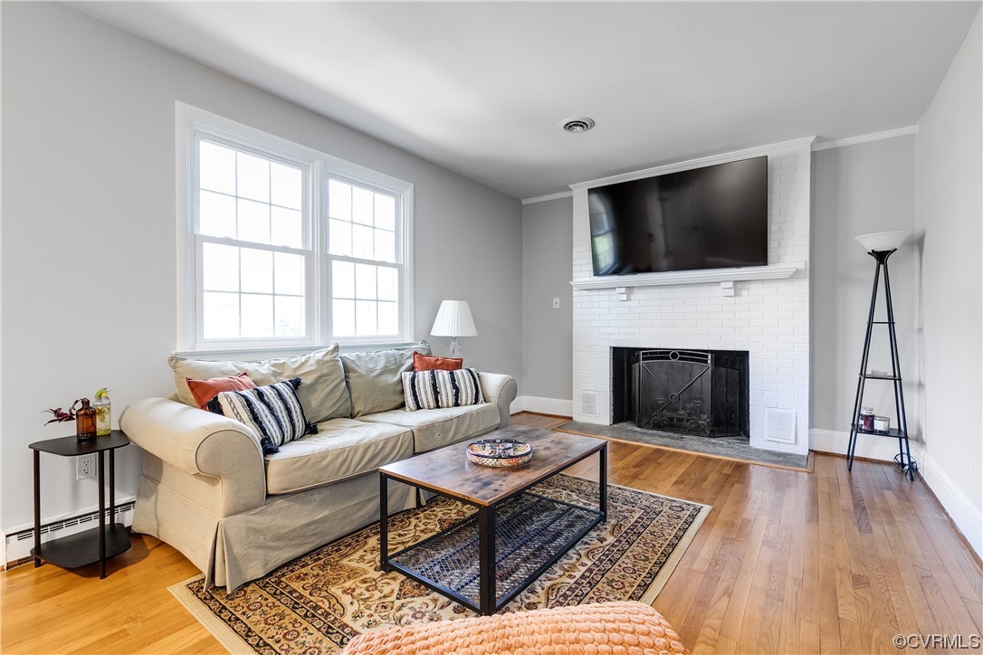 13409 Oak Lane Midlothian, VA 23113 - Photo 3 of 19 a living room with furniture fireplace and flat screen tv