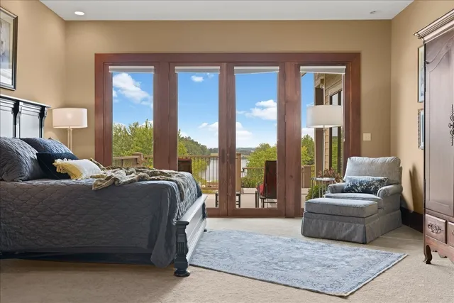 a spacious bathroom with a tub mirror and sink