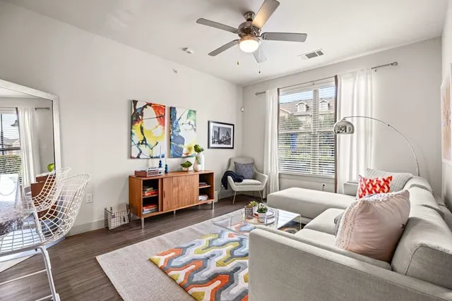 a living room with furniture and a window