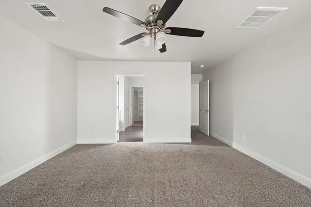 a view of a hallway with a white walls
