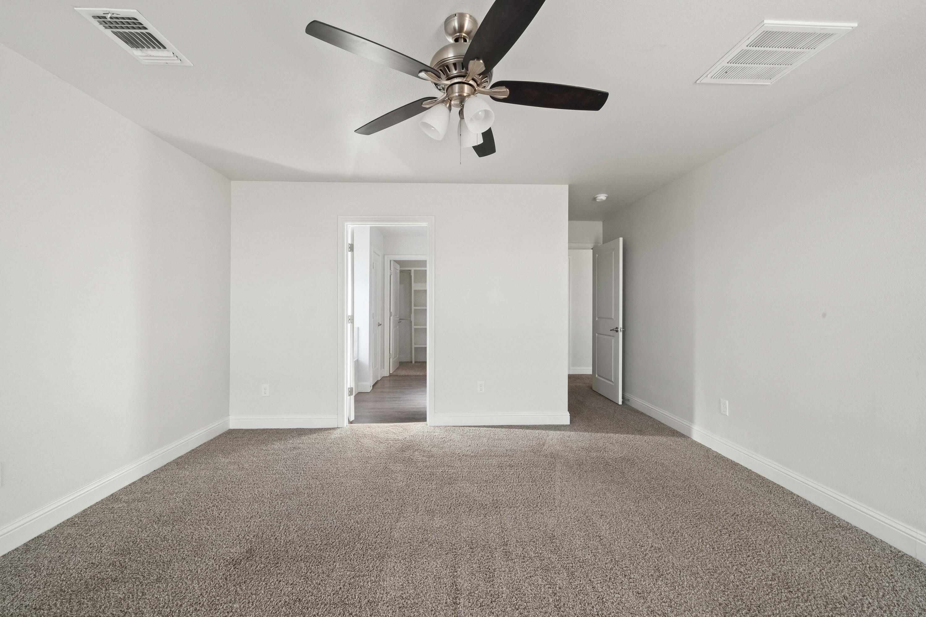 7523 87th Street Lubbock, TX 79424 - Photo 11 of 23 wooden floor in an empty room