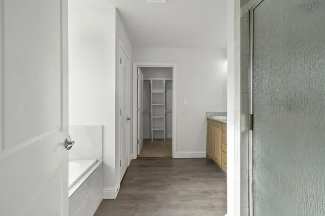 a white bath tub sitting next to a window